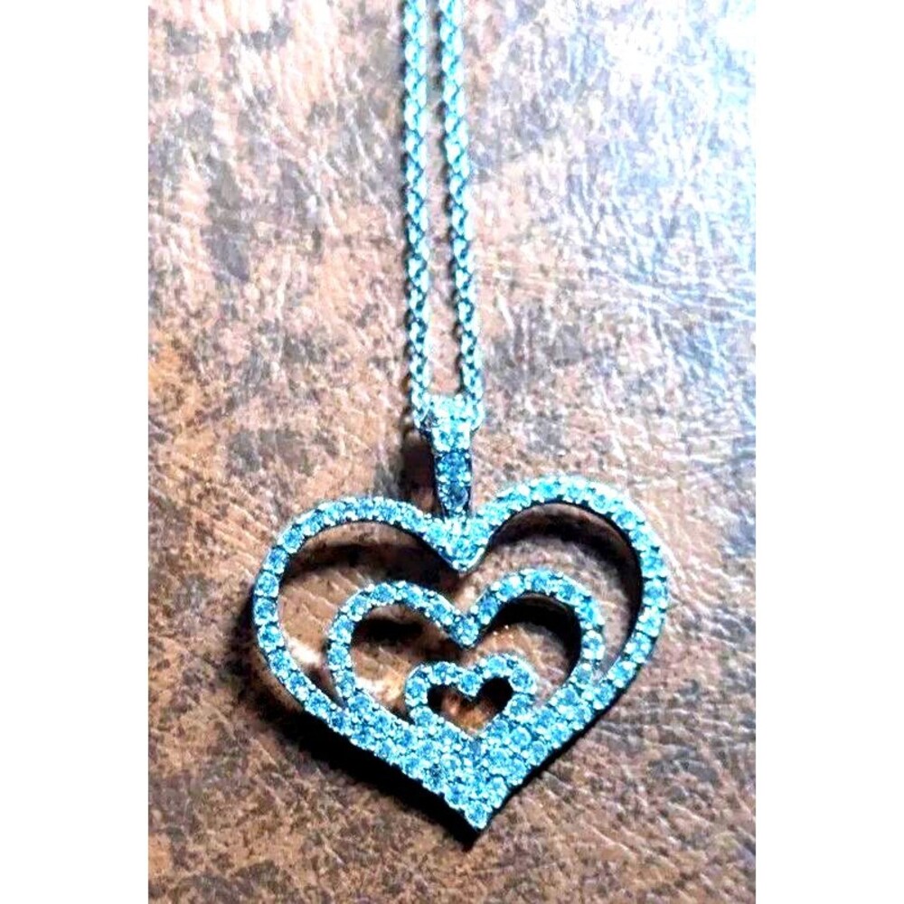 Timeless Elegance: The Nolan Miller Triple Heart Necklace